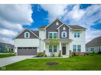 Charming two-story home with a well-manicured lawn and attached two car garage at 15792 Wiseman Dr, Fishers, IN 46040