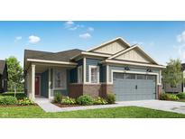 Charming exterior with blue siding, brick accents, and a two-car garage at 19473 Boulder Brook Ln, Westfield, IN 46074