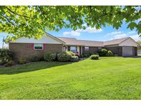 Charming brick home with lush green lawn and well-manicured landscaping at 2769 S 800 W, Indianapolis, IN 46239