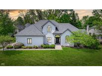 Charming home with well-manicured lawn, lush landscaping, and a welcoming entrance creating great curb appeal at 3162 Hazel Foster Dr, Carmel, IN 46033