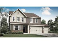 Charming two-story home with a three-car garage, brick accents, and landscaped yard at 4411 Mendocino Blvd, Indianapolis, IN 46239