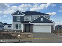 New two-story home with blue and gray siding, a two car garage, and fresh concrete driveway at 5784 Summertree Pl, Whitestown, IN 46052
