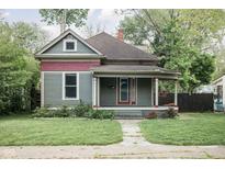 Charming exterior of a two-story home featuring a covered porch and inviting curb appeal at 6159 Broadway St, Indianapolis, IN 46220