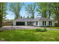 Charming single-story home featuring a two-car garage and well-manicured front lawn at 6673 Karyn Dr, Avon, IN 46123