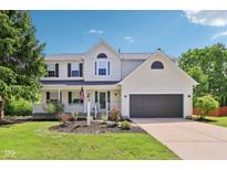 Charming two-story home with a welcoming front porch and well-maintained landscaping at 7388 Wythe Dr, Noblesville, IN 46062