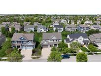 An aerial view of a neighborhood showcases the well-maintained lawns and various home styles at 12722 Moonseed Dr, Carmel, IN 46032