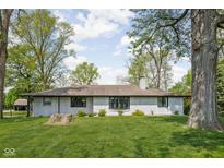 Charming brick ranch with a well-maintained front yard and mature trees, offering great curb appeal at 13765 Howe Rd, Fishers, IN 46038