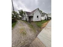 Charming single-Gathering home featuring a gravel driveway and welcoming front porch at 350 Johnson Ave, Franklin, IN 46131