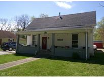 Charming single-story home with a covered front porch and well-maintained lawn at 4200 Ann St, Plainfield, IN 46168
