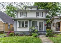 Charming two-story home with a landscaped front yard and welcoming entrance at 4244 Rookwood Ave, Indianapolis, IN 46208