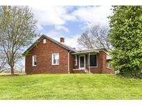 Charming brick home with a well-maintained lawn and inviting entrance at 6585 N Waverly Park Rd, Martinsville, IN 46151
