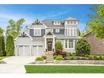 Charming two-story home with a manicured lawn, lovely landscaping, a two-car garage, and a welcoming front entrance at 6734 W Stonegate Dr, Zionsville, IN 46077