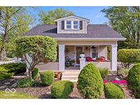 Charming home with landscaped front yard and inviting porch at 744 Gilbert Ave, Indianapolis, IN 46227