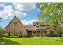 Charming brick home featuring an attached garage, lush landscaping, and inviting curb appeal at 101 Applecross Dr, Brownsburg, IN 46112