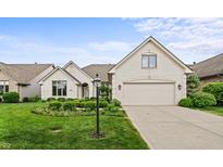 Charming brick home with manicured front yard and attached two car garage at 12739 Kiawah Dr, Carmel, IN 46033