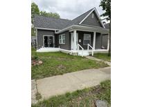 Charming home with gray siding, a new roof, and a welcoming white porch at 1327 Union St, Columbus, IN 47201