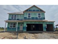 Two-story house with a two-car garage is under construction, ready for customization and finishing touches at 1335 Foxtail Ln, Greenwood, IN 46143