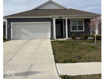 Charming single-story home with attached garage, well-kept lawn, and inviting front porch at 1380 Fairmount Dr, Greenfield, IN 46140