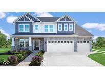 Charming two-story home with a stone facade, a two-car garage, and beautifully landscaped front yard at 175 Rock Island Rd, Westfield, IN 46074