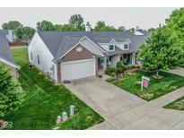 Charming single-story home with a well-manicured lawn and inviting front porch at 270 Rapid Rill Ln, Brownsburg, IN 46112