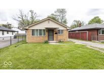 Charming brick home with well-maintained lawn and inviting curb appeal at 3510 E 34Th St, Indianapolis, IN 46218