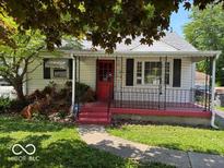 Charming single-story home featuring a cozy front porch and well-maintained lawn at 3528 Orchard Ave, Indianapolis, IN 46218