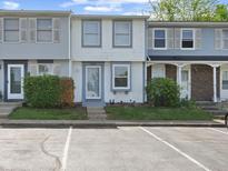 Charming townhome featuring muted blue and gray tones with well-maintained landscaping, and clearly marked street address at 3705 Lima Ct, Indianapolis, IN 46227