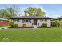 Exterior shot of renovated house including new landscaping and expansive front lawn at 4337 N Audubon Rd, Indianapolis, IN 46226