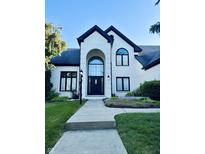 Beautiful two-story home featuring a grand entrance and landscaped front yard at 4601 Fairhope Dr, Indianapolis, IN 46237