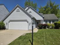 Charming single-Gathering home with well-manicured lawn and attached two-car garage at 6369 Kelsey Dr, Indianapolis, IN 46268