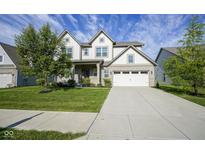 Charming two-story home with a well-manicured lawn and a spacious two car garage, perfect for Gathering living at 9822 Tampico Chase, Fishers, IN 46040