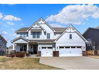 Charming two-story home boasts a manicured lawn, a welcoming porch, and a convenient two-car garage, ideal for Gathering living at 16516 Wilsons Farm Dr, Fishers, IN 46040