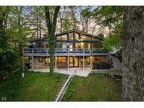 Charming exterior of a two story home with balcony, patio, and hot tub at 7753 Ivy Dr, Nineveh, IN 46164