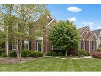 Charming two-story brick home with mature trees and manicured lawn at 10155 Landis Blvd, Fortville, IN 46040