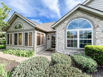 Charming home featuring stone accents, large windows, and well-manicured landscaping, creating inviting curb appeal at 16657 Brownstone Ct, Westfield, IN 46074