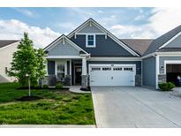 Charming single-Gathering home featuring stone accents, a two-car garage, and well-maintained landscaping at 2675 Cottage Ct, Brownsburg, IN 46112