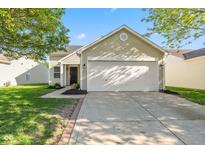Charming single-Gathering home featuring a two-car garage, front yard, and a well-manicured lawn at 3119 Earlswood Ln, Indianapolis, IN 46217