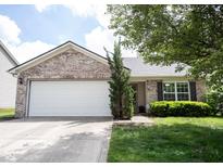 Charming single-story home with a two-car garage, and a well-maintained front yard at 7131 Blue Ridge Dr, Noblesville, IN 46062