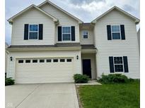 Charming two-story home featuring black shutters, a two-car garage, and a well-maintained lawn at 837 Sommersweet Run, Greenwood, IN 46143