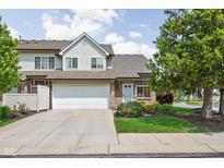 Charming townhome with an attached garage, manicured lawn, and beautiful landscaping at 9404 Enclave Dr # D, Avon, IN 46123
