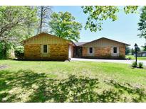 Charming brick ranch home featuring a well-maintained lawn and welcoming curb appeal at 5979 E Oak Hl Dr, Plainfield, IN 46168