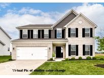Charming two-story home with brick facade, gray siding, black shutters, and well-manicured lawn at 9860 Gallop Ln, Fishers, IN 46040