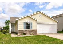 Charming single-story home featuring a two-car garage, brick facade, and well-manicured lawn at 11816 Wapiti Way, Noblesville, IN 46060