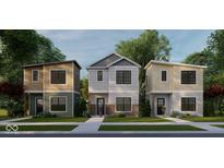 New construction featuring modern townhomes with unique architectural details, green lawns, and welcoming entrances at 1429 Deloss St, Indianapolis, IN 46201