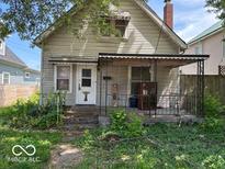 Quaint two-story home with a covered porch, offering curb appeal and outdoor living space at 155 S Elder Ave, Indianapolis, IN 46222