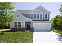 Charming two-story home featuring a two-car garage and beautifully landscaped front yard at 19570 Forsythe Dr, Noblesville, IN 46060