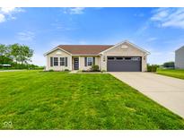 Charming single-story home with a well-maintained lawn and attached two-car garage at 204 Oakview Dr, Mooresville, IN 46158
