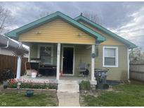 Charming, two-story home with a covered front porch and landscaping at 2146 Gent Ave, Indianapolis, IN 46202