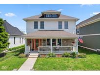 Charming two-story home with a welcoming front porch, stone accents, and a well-manicured lawn at 2919 Macpherson Ave, Indianapolis, IN 46205