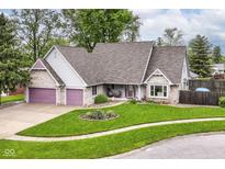 Charming home with manicured lawn, beautiful landscaping and brick accents on front elevation at 436 Maria Dr, Greenwood, IN 46143
